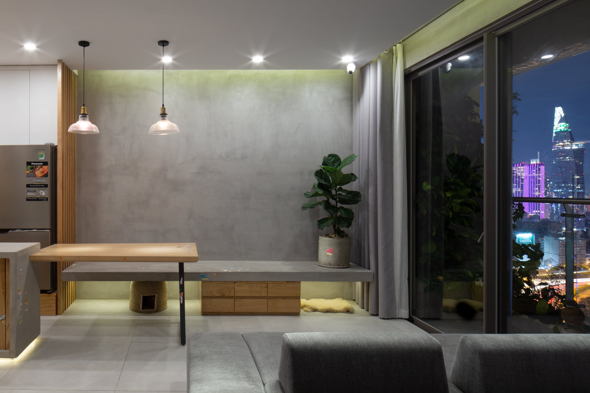 An apartment as the city lights up — photographed by OWL